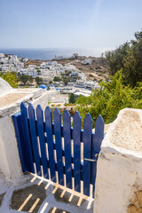 The blue gate, a characteristic element of the Cycladic architecture. Ios Island, Greece