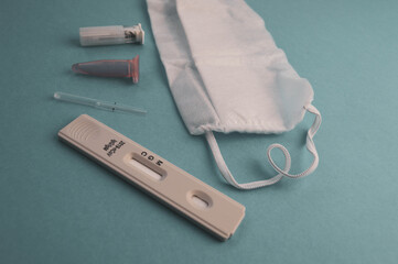 swab test tube for 2019-nCoV analyzing. Coronavirus test. Blue medical gloves and protective face...