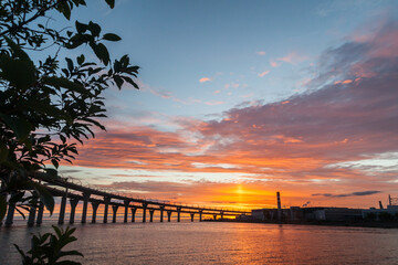 Fototapeta na wymiar Sunset landscape with highway bridge