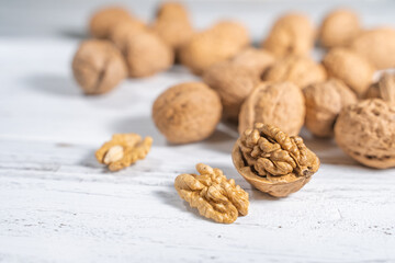 Walnuts kernels on white wooden desk, stock photo