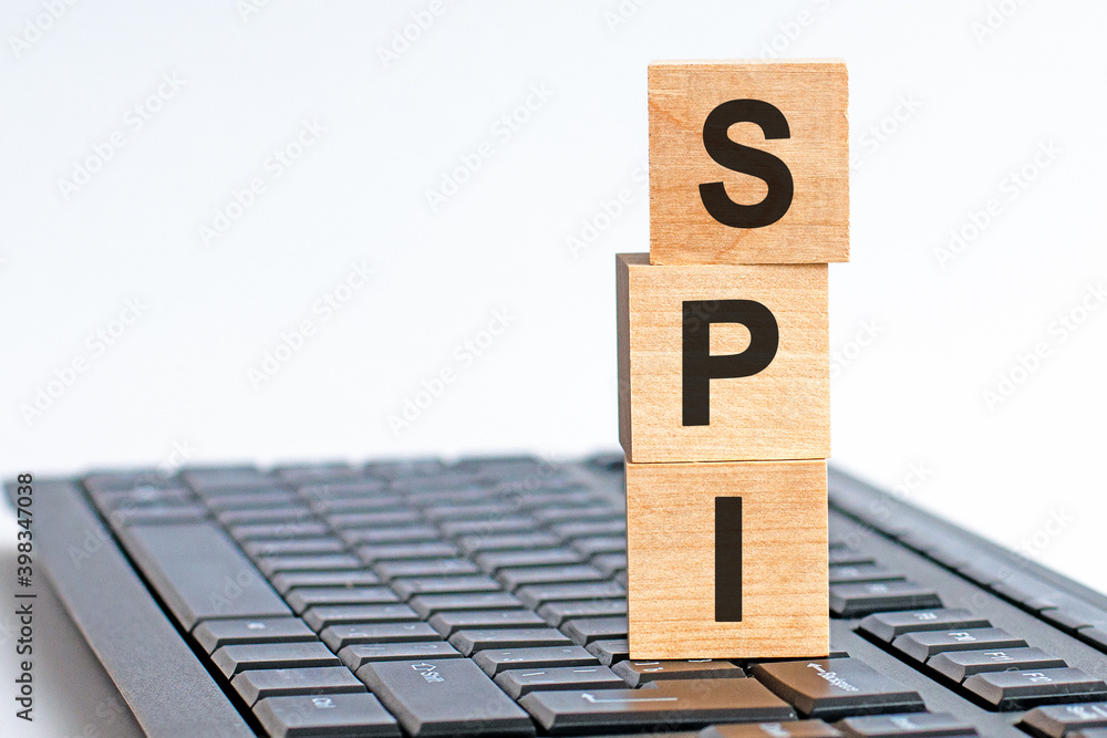 Poster spi word on wooden block sign on a keyboard