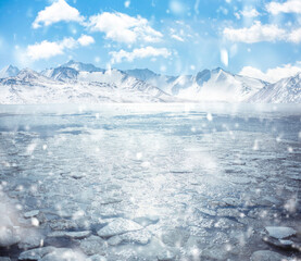 frozen mountain lake in winter with broken ice cracks. Large chunks of floating ice are driven into the sea. Pack ice creates icebergs. © Кристина Пахомова