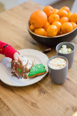 Christmas table with cookies and tangerine