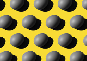 gray Eggs pattern on yellow background. repetitive, duplicate items. easter conception. Color 2021