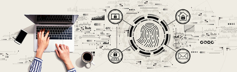 Fingerprint scanning theme with person using a laptop computer