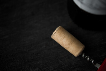 Fototapeta na wymiar Uncorked cork in the corkscrew