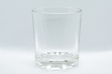 Glass on light background with selective focus