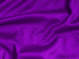 Fototapeta na wymiar Shiny purple crumpled fabric texture. Elegant wavy cloth background