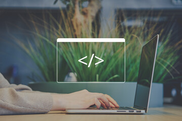 Freelancer person in a cafe is coding on a laptop