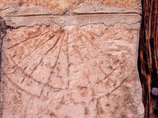 Sundial on the facade of a house in a town in Madrid Spain.