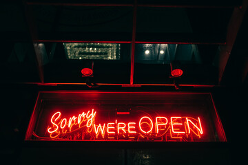 sorry we're open signage