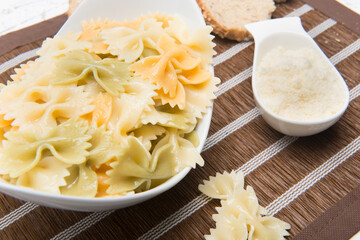 plate of pasta bows with parmesan cheese