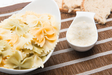 plate of pasta bows with parmesan cheese