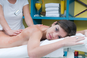 young woman getting a treatment for her skin in a spa