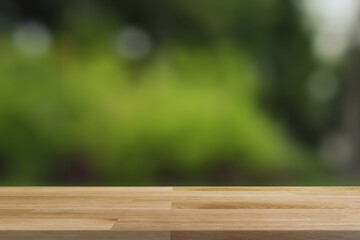 Wooden board empty table in front of blurred background. Perspective brown wood over blur bokeh abstract background - can be used for display or montage your products.Mock up for display of product.
