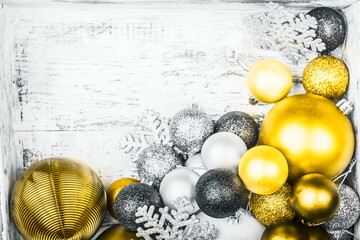 Christmas decorations in the wooden box as a preparation for decorating the xmas tree. Pastel...