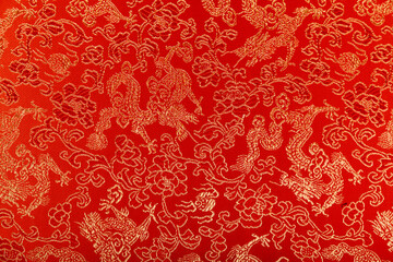 Top view of Chinese patterns on red fabric