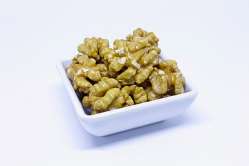 Portion of fresh walnuts isolated on white background