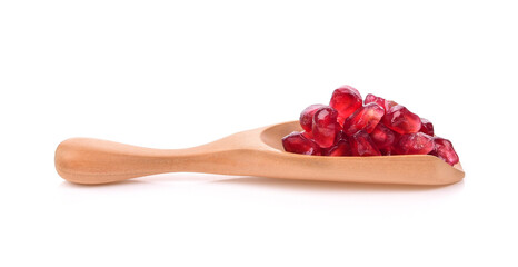 Fruit pomegranate in wood scoop on white background