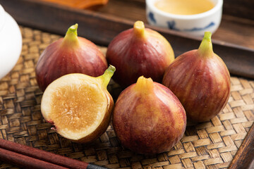 Fresh fruit figs on the background of retro Chinese style tea tray