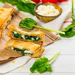 Spinach and Feta Cheese Strudel. Puff Pastry Filled with Spinach and Ricotta Cheese. Selective focus.