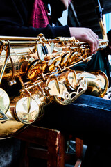 hand and saxophone details in a band, music show