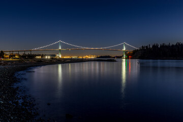 Fototapeta na wymiar Lion's Gate Bridge at dusk or after sunset and blue hour - Vancouver, BC Canada travel and tourism