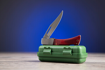 small knife on green box