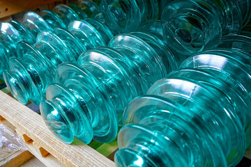 Glass insulators for high-voltage electric poles are on the shelf. Storage of materials for...