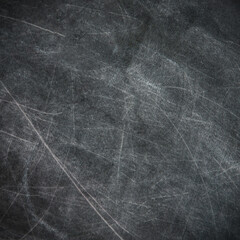 back to school: black chalkboard with blurry traces of white chalk and crayons, minor scratches