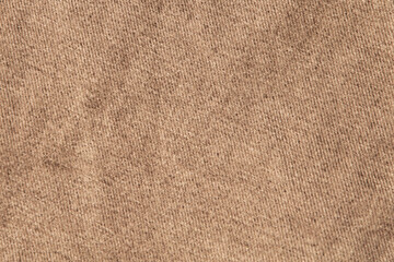 Fototapeta na wymiar fabric grunge background, real cotton denim brown, wrinkled, frayed, close