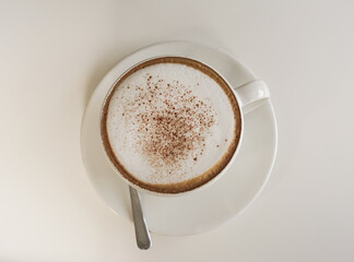 Top view cup of cappuccino on white background
