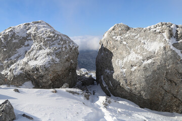 Two big rocks snow covered 