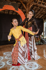 Javanese indonesian dance instructor teach a dance movement to her student