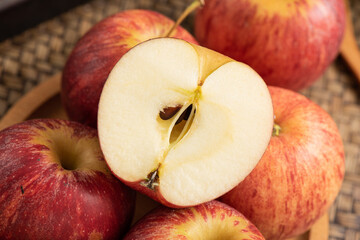 Fresh fruits and small apples on the background of retro Chinese style tea tray