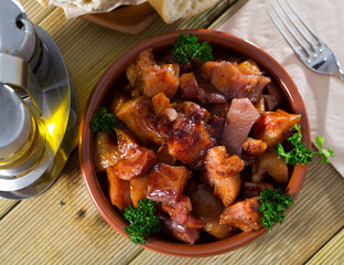 Spanish dish - roasted pig nose and cheeks. High quality photo