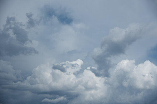 Beautiful sky background. Light blue and gray sky with a dramatic view of clouds. High quality photo © Avi