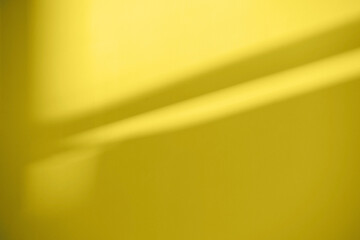 Abstract background of a  yellow drywall during renovation with the shadow of the frame indoor. New color of 2021 Yellow.