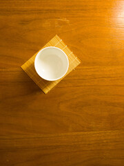japanese tea cup on wooden table, sense of comfort, relax, me time under sunlight