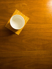 japanese tea cup on wooden table, sense of comfort, relax, me time under sunlight