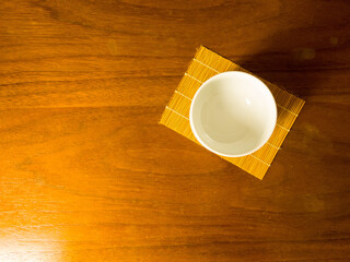 japanese tea cup on wooden table, sense of comfort, relax, me time under sunlight