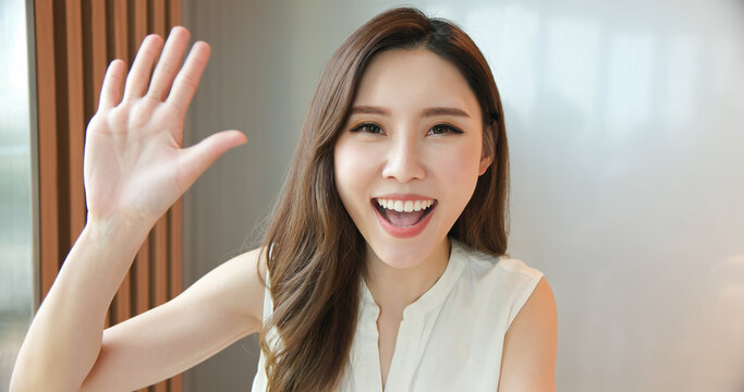 asian woman has video chat - Powered by Adobe
