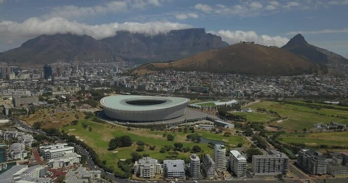 4K sunny day aerial video of Green Point Lighthouse, waterfront, park, promenade. Green Point is Cape Town's upmarket Atlantic Seaboard residential suburb, Cape Peninsula, Western Cape, South Africa