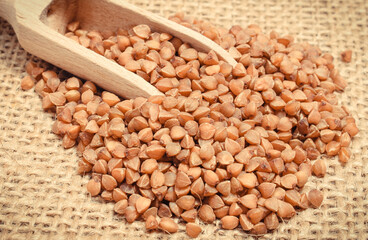 Buckwheat with scoop. Food containing minerals and fiber