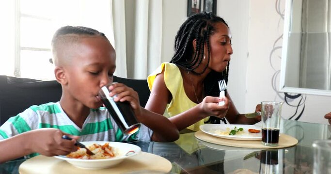 African Family Eating Meal, Child Drinking Soda Beverage At Lunch