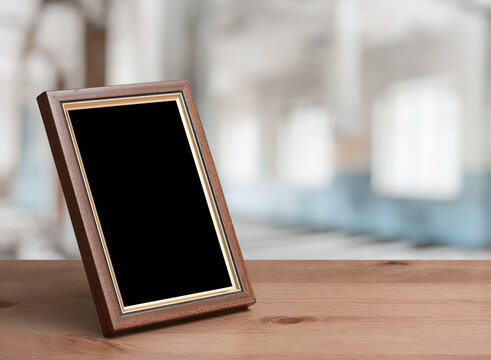 photo frame on the wooden table