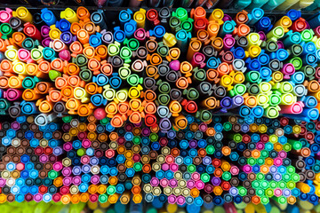 Fototapeta na wymiar Top view of mixed colorful markers placed in the box. Pattern and texture. Background. Stationery.