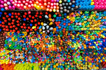 Fototapeta premium Top view of mixed colorful markers placed in the box. Pattern and texture. Background. Stationery.