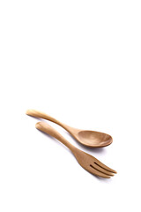 Close up wooden fork and spoon on white
