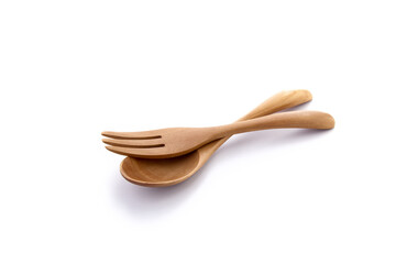 Close up wooden fork and spoon on white